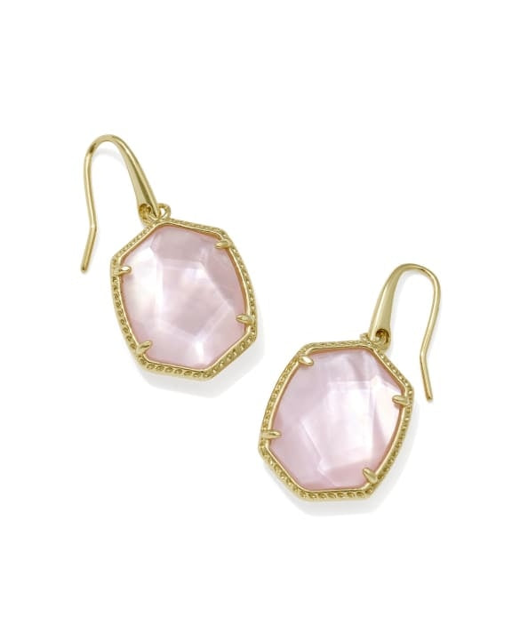 Daphne gold frame drop earrings with carved stones and hoofprint detailing on earwire closure.