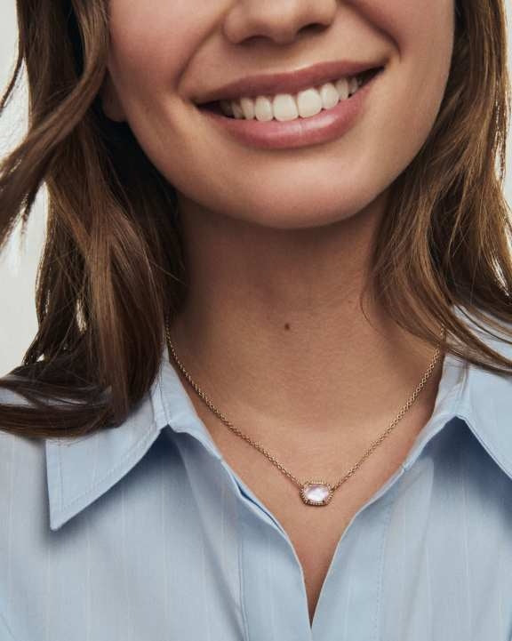 Daphne frame short pendant necklace in gold-tone metal with a rectangular bezel setting.