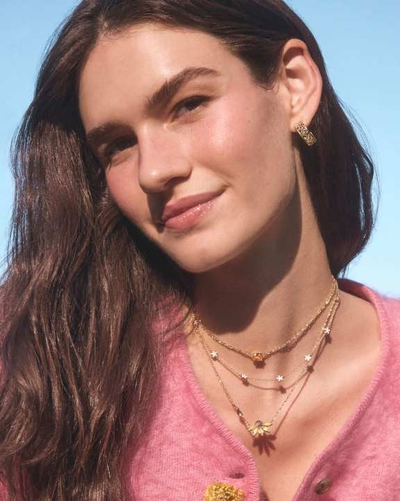 Jane Gold Strand Necklace with white enamel floral motifs on an adjustable chain.