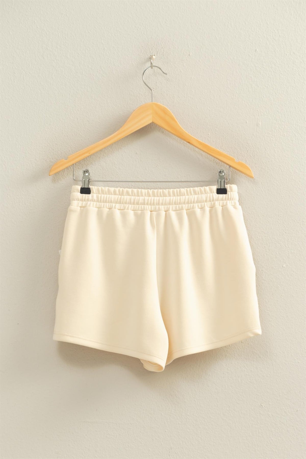Sylvia drawstring waist shorts in a soft neutral tone with an elasticized waistband and relaxed silhouette.