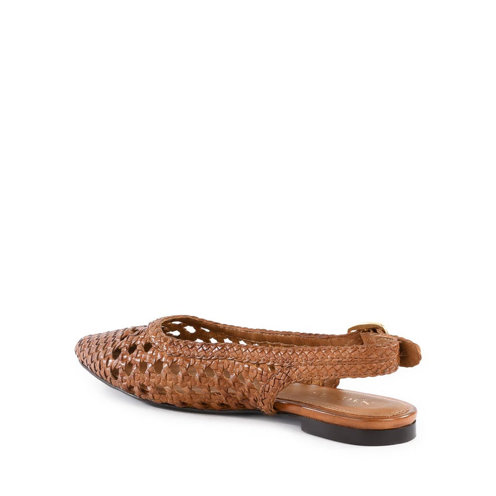 Avalon Flat sandal in almond leather with an adjustable buckle closure and open back silhouette.