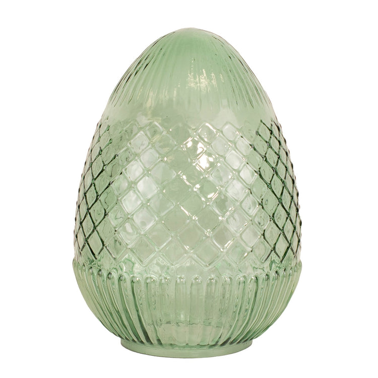 Handcrafted glass egg with vivid hue and intricate surface details.