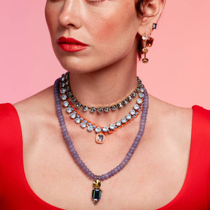 Antique gold plated Oakland necklace with candy crush crystal pendants on a brass chain.