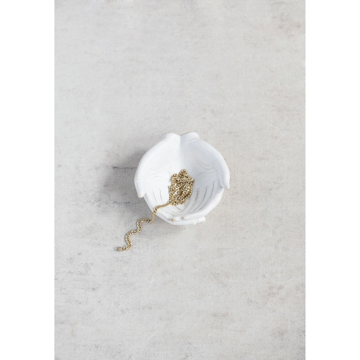 White stoneware hands bowl with reactive glaze finish