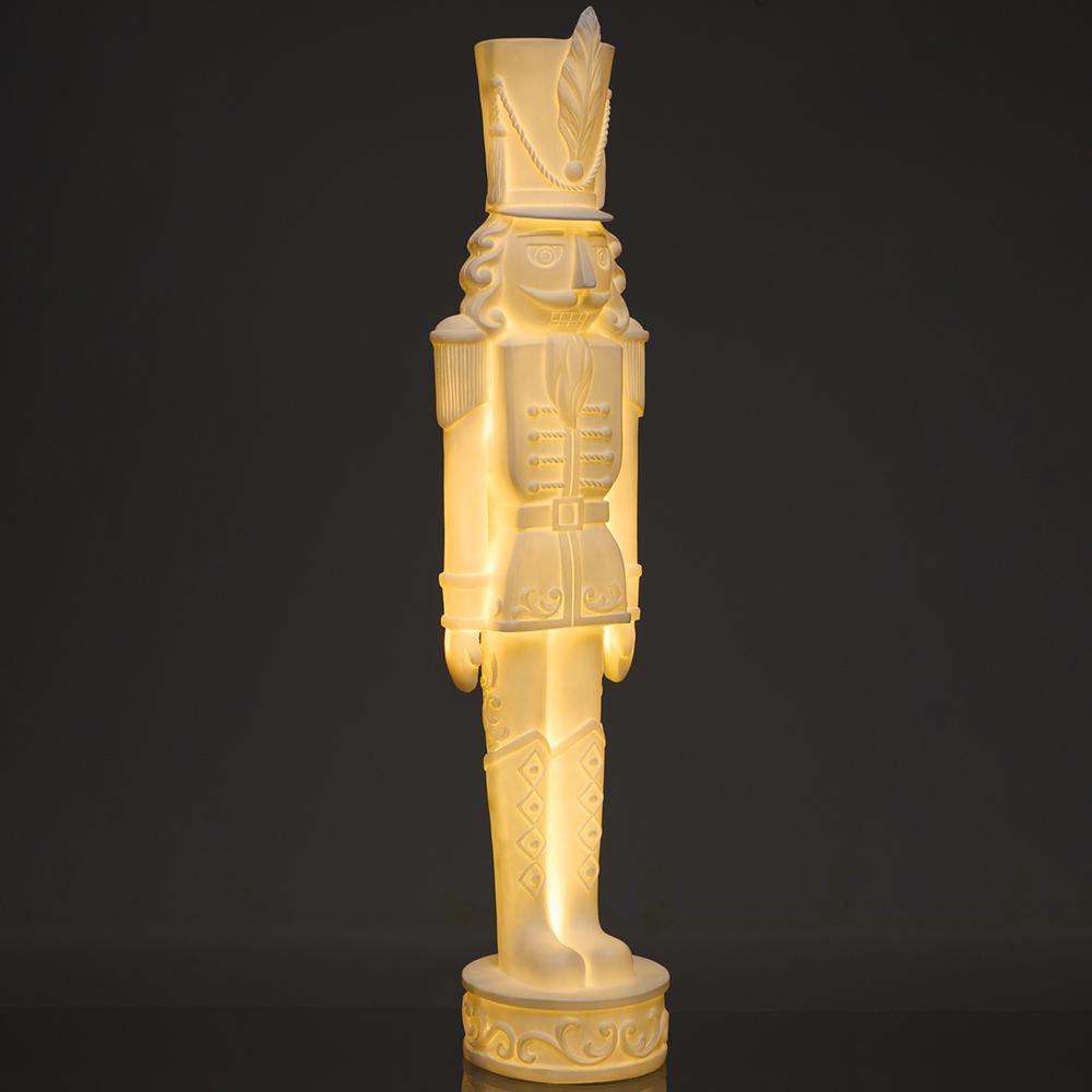 37.5-inch lighted antique white nutcracker statue with a warm internal glow.