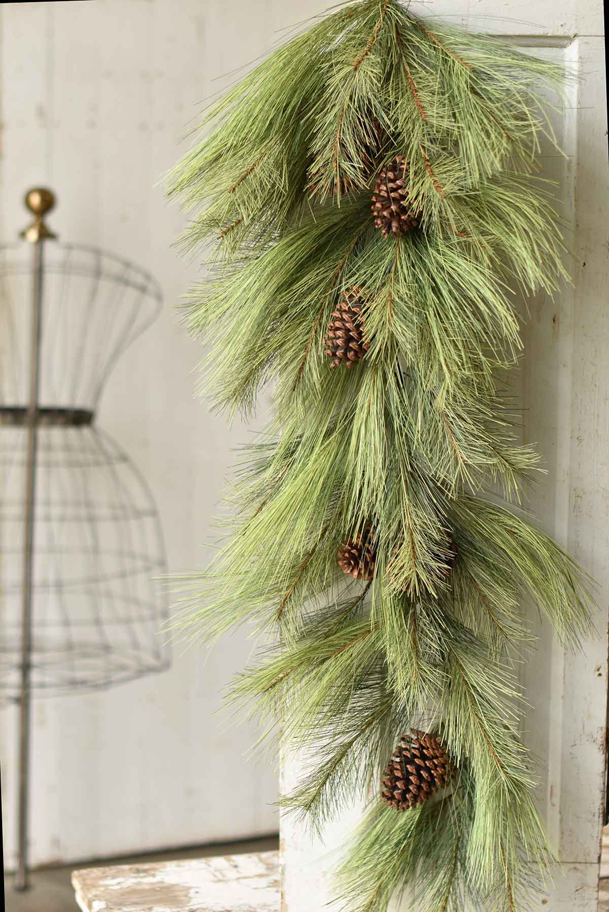48-inch mixed needle pine teardrop swag with realistic green needles and brown pinecones.