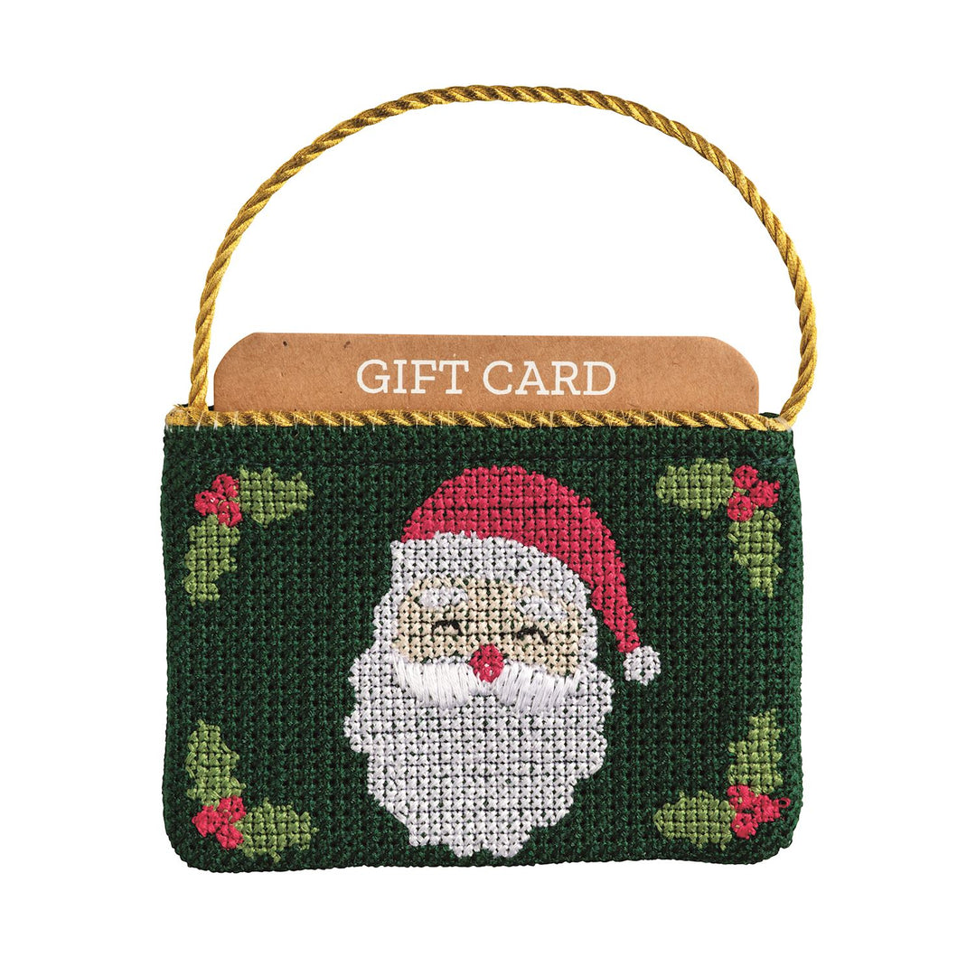 Green needlepoint gift card pouch with Santa Claus design and a gold cord hanger.