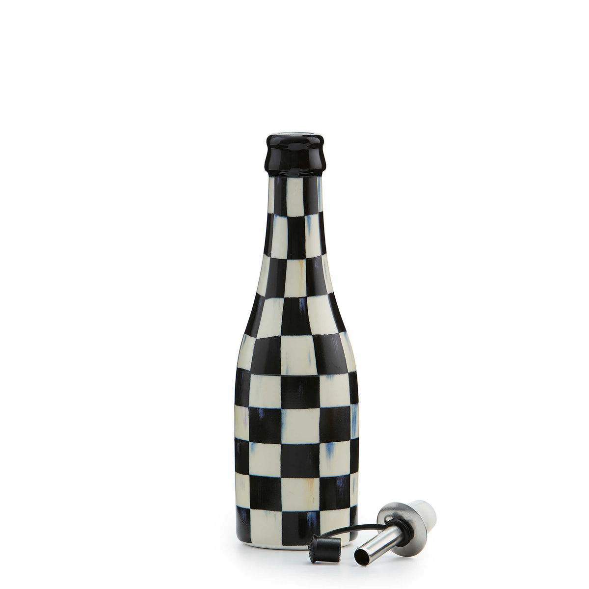 Black and white checkered ceramic oil cruet with a separate stainless steel pourer.