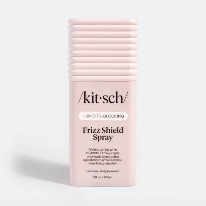 Kitsch Humidity-Blocking Frizz Shield Spray in a pink 6 fl. oz. bottle with a ribbed cap.