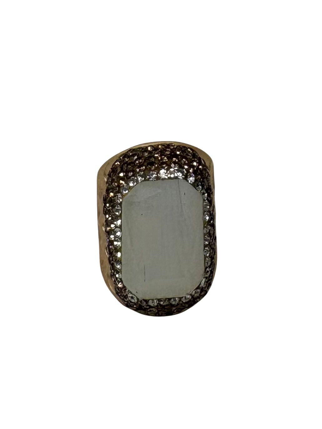 Fashion gemstone ring featuring a large rectangular light blue stone surrounded by dark crystals.