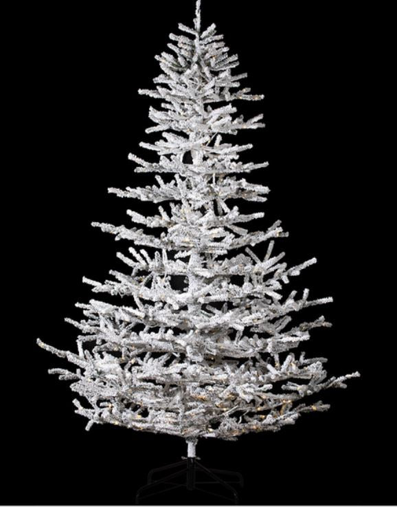 8-foot flocked garden Christmas tree with 850 rice lights on a black metal stand.