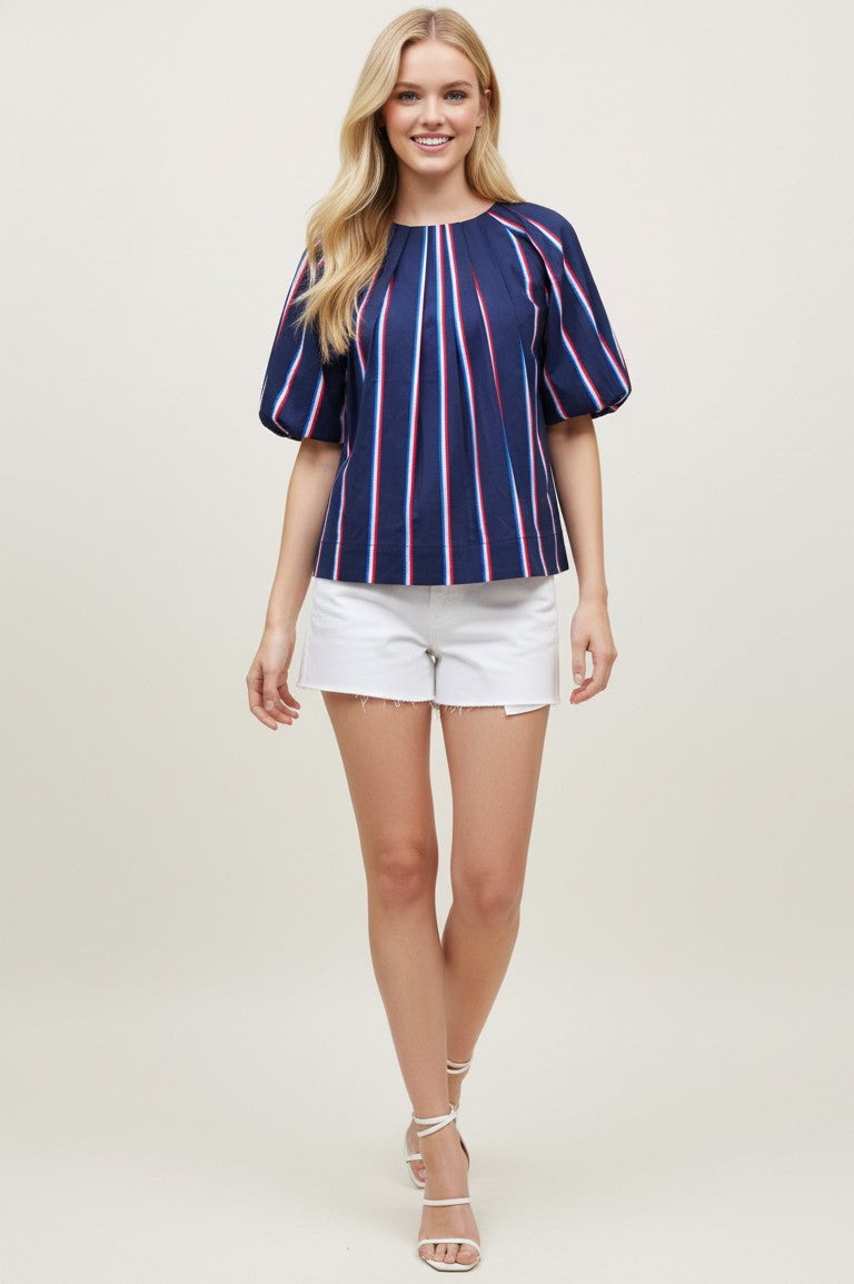Stella USA inspired stripe blouse in cotton with round neck, balloon sleeves, tucked detail, and back button closure.