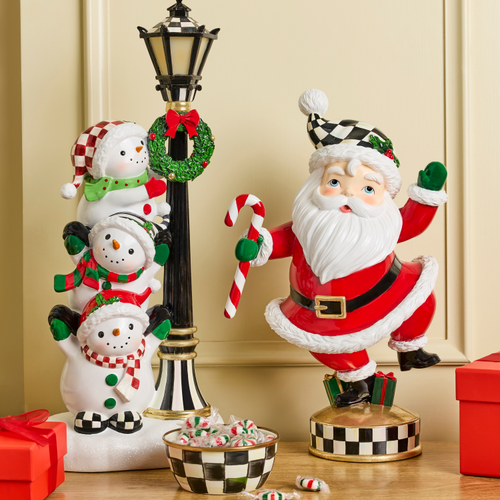 Illuminated snowman lamppost figurine with three stacked snowmen and a dancing Santa Claus.