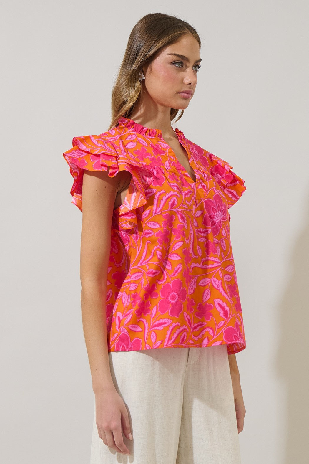 Rea Floral Emery split neck top in floral print cotton fabric with a relaxed silhouette.