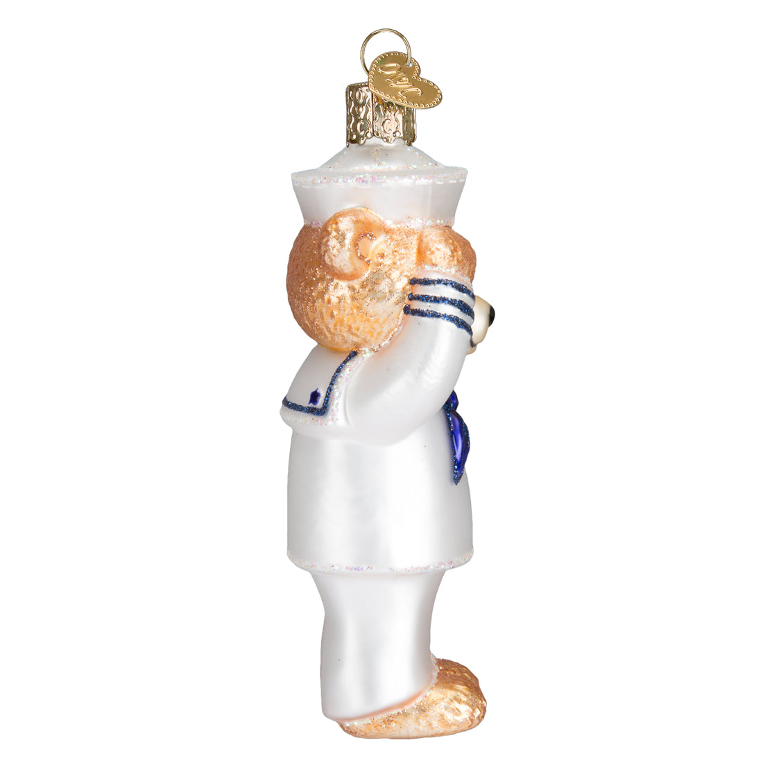 Side view of a glass Navy Bear ornament in a white sailor uniform saluting.