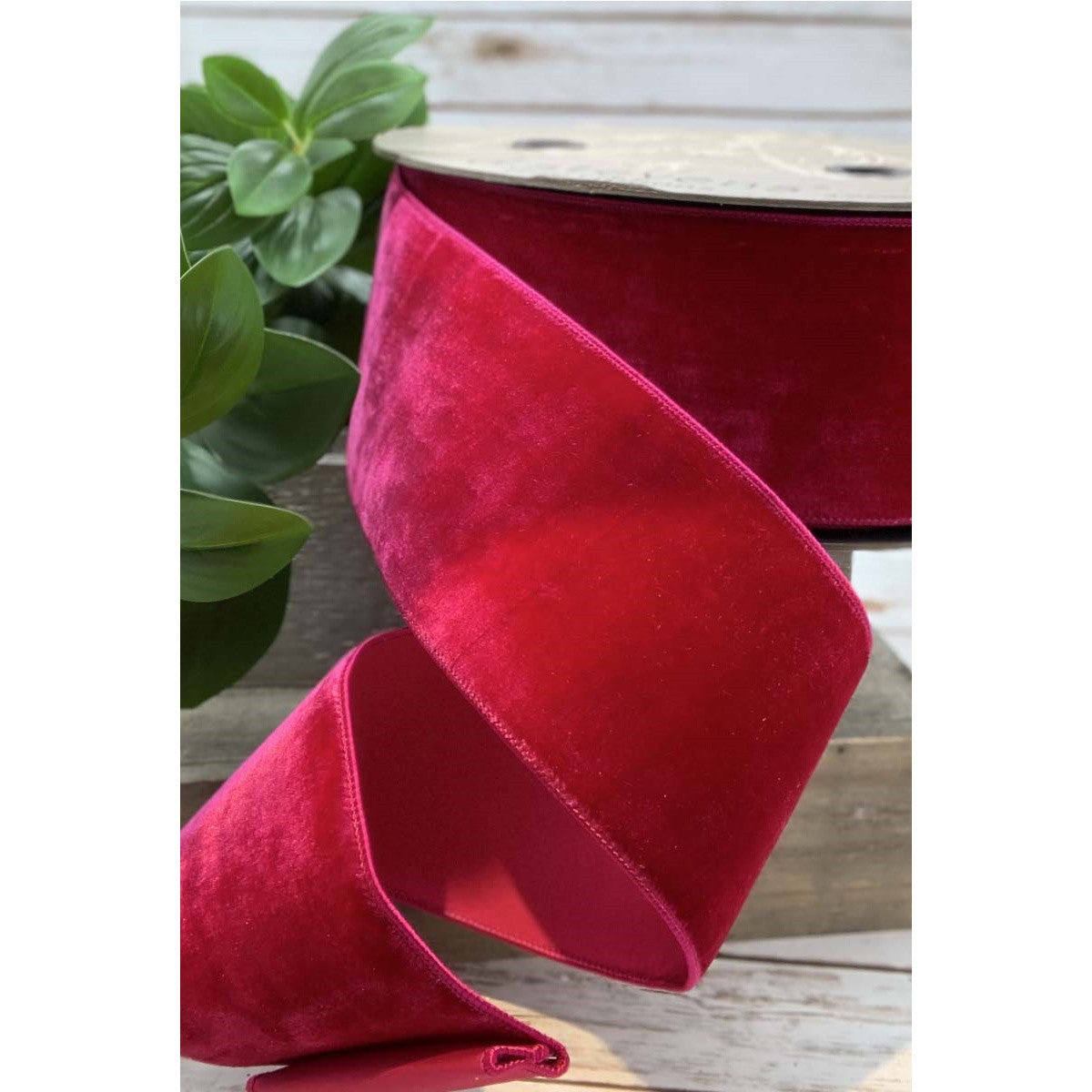 2.5-inch wide magenta velvet ribbon with a faux dupion back on a spool.