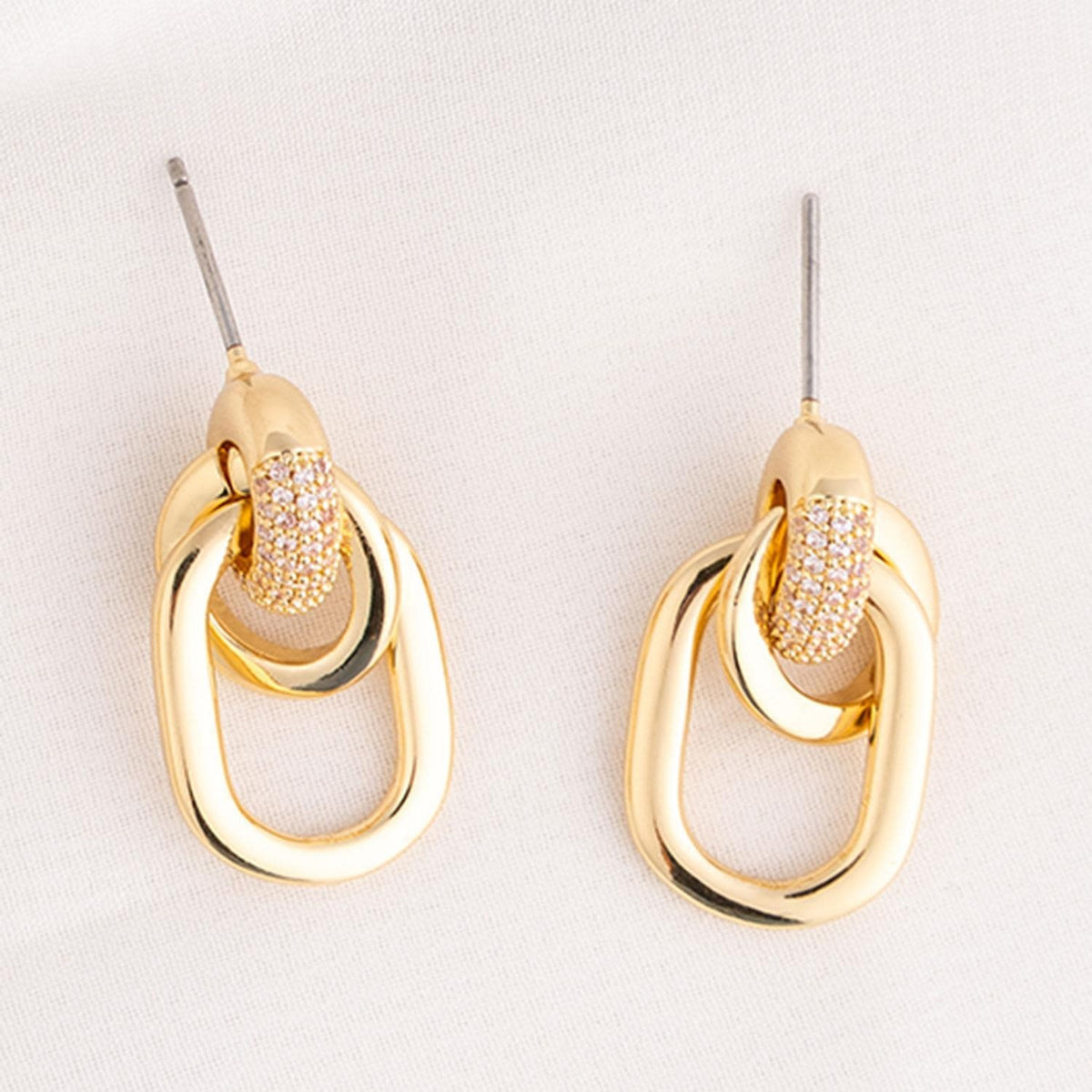 Brass plated drop earrings with clear cubic zirconia stone accents