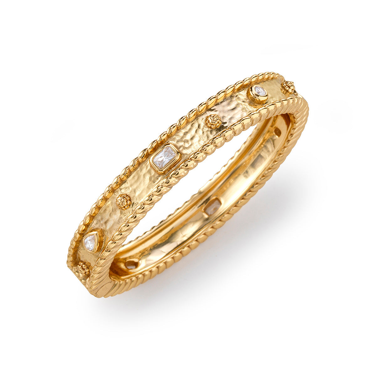 Hinged bangle bracelet in clear cubic zirconia stones set on an 18K gold over brass band.