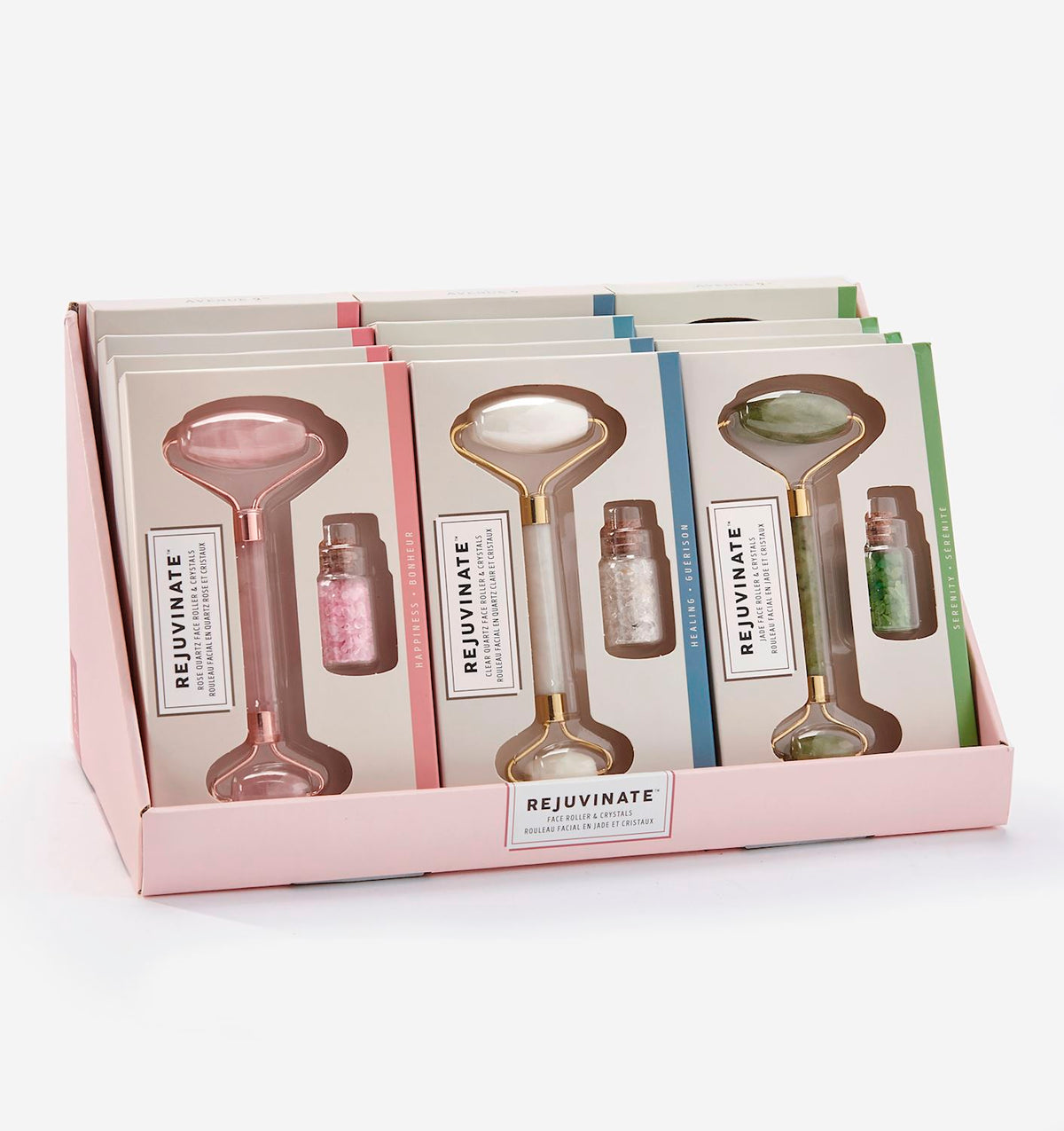 Display box of Rejuvinate Gemstone Face Roller & Crystals Sets in rose quartz, clear, and jade.