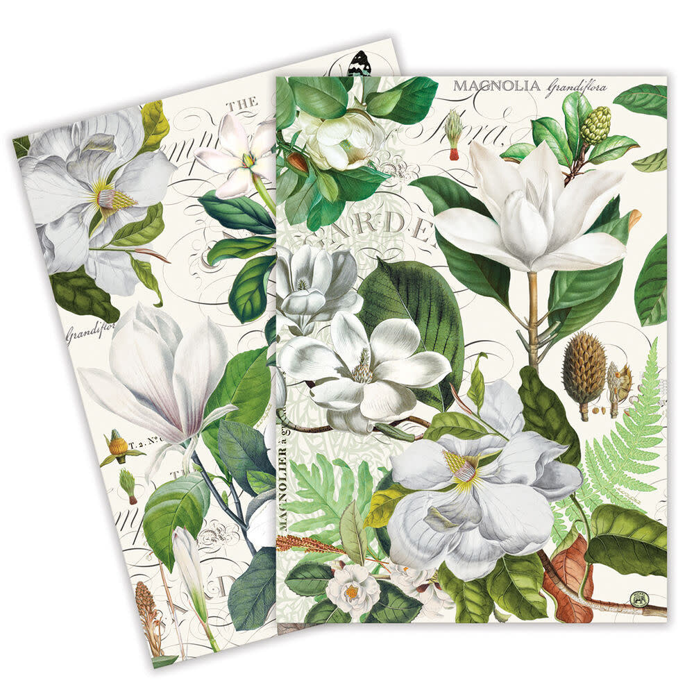 Kitchen towel featuring a vintage botanical print of white magnolia flowers and green leaves.