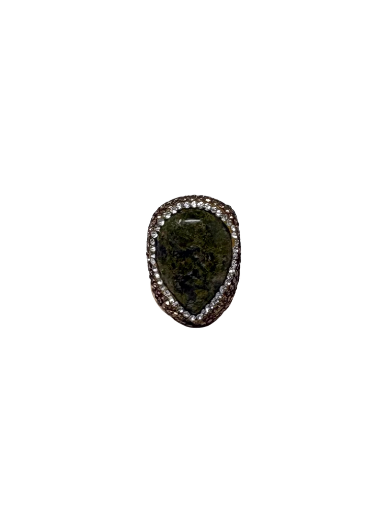 Queen of Sheba Fashion Ring featuring a dark green teardrop stone with a sparkling halo border.
