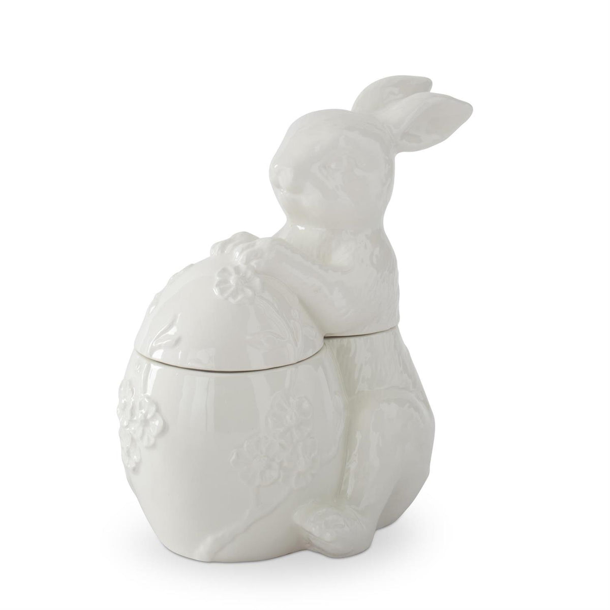 White dolomite ceramic egg-shaped container with embossed flower patterns.