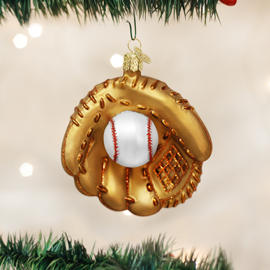Red baseball mitt ornament with white lacing hanging from a gold loop.