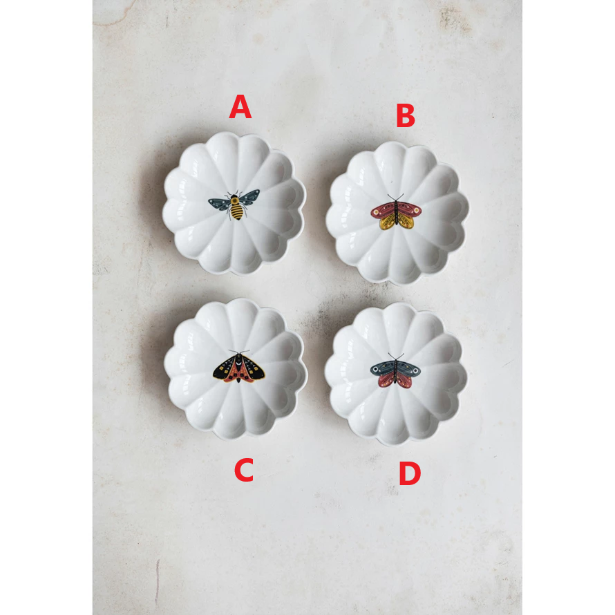 Round stoneware scalloped dish in natural color with a small insect silhouette on the rim.