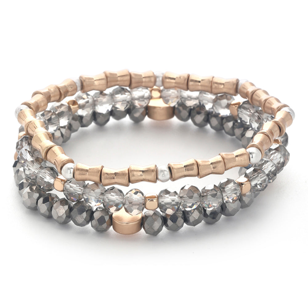 Set of three stretch bracelets with rose gold, silver, and faceted grey glass beads.