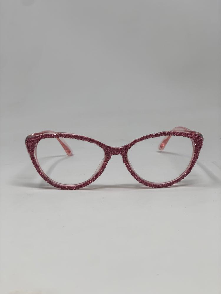 Pink cat-eye rhinestone reading glasses with clear lenses on a white background.