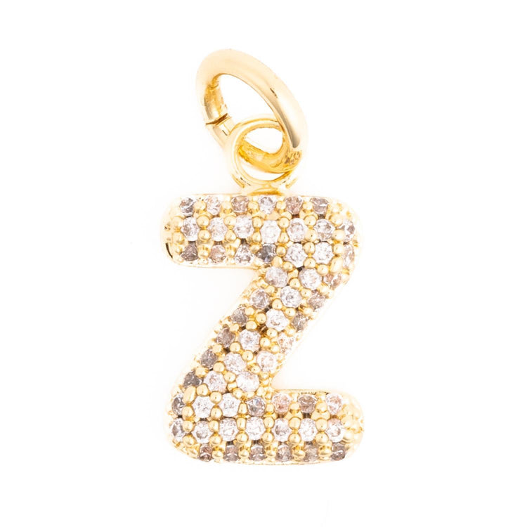 Gold letter Z charm pendant encrusted with small white and champagne diamonds.