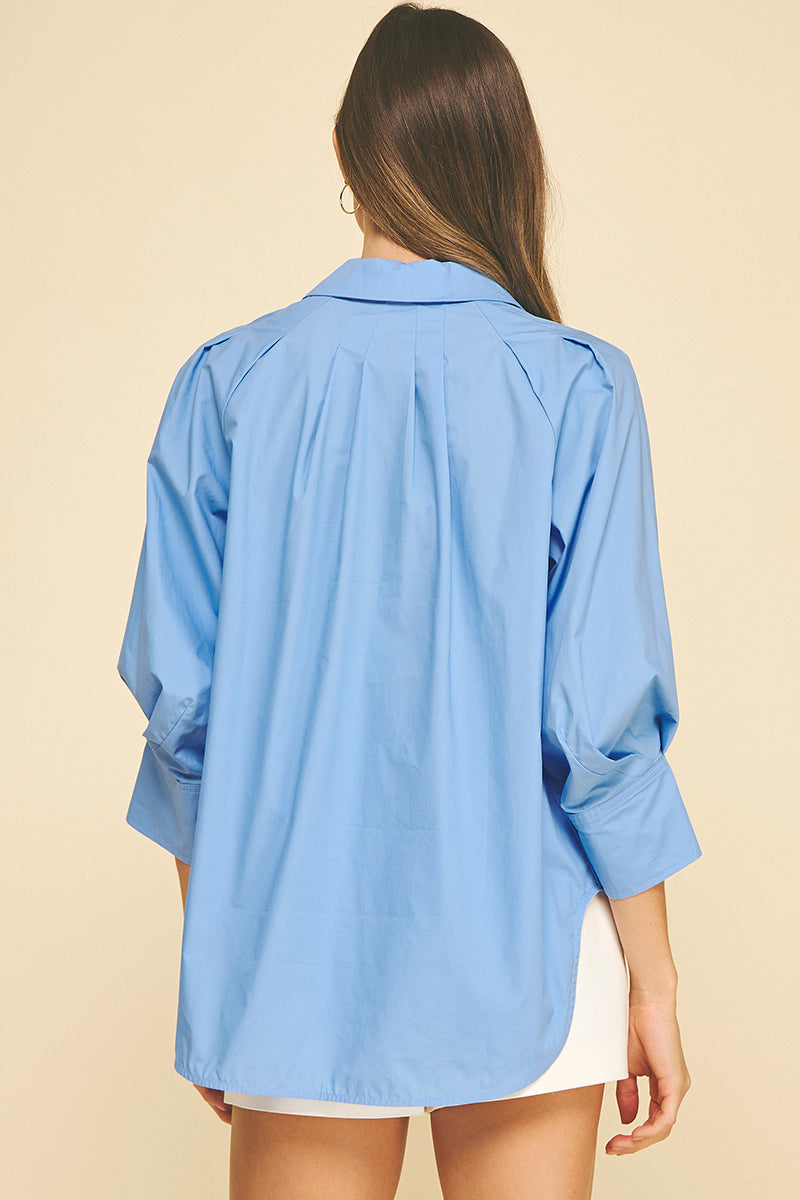 Women's Elle V-neck button-down shirt in white cotton with wide cuffs and side slits.