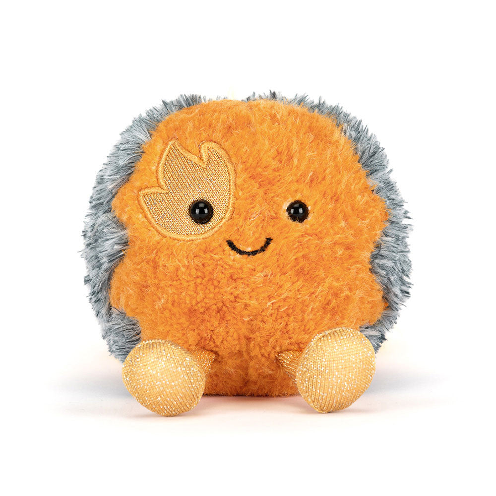 Amuseables Space Comet plush toy with orange fuzzy body, grey outer ring, and gold glittery feet.