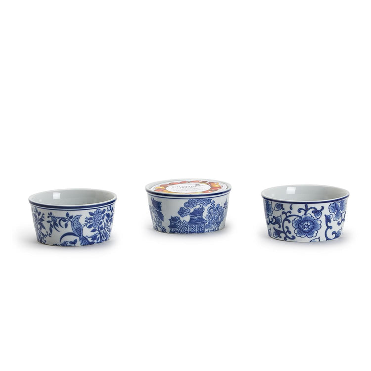Three 8 oz. blue and white chinoiserie porcelain deli container holders with various patterns.