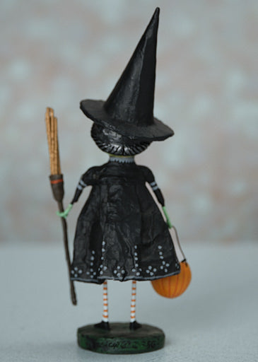 Wicked Witch figurine made of poly resin with a green skin tone, black hair, and pointed hat.