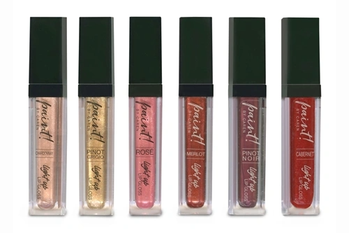 Wine by the Gloss Light up Lip Gloss in a clear tube with silver cap and pink liquid.