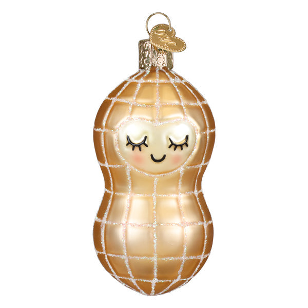 Glass peanut Christmas ornament with a smiling face, gold glitter grid, and heart-shaped metal tag.