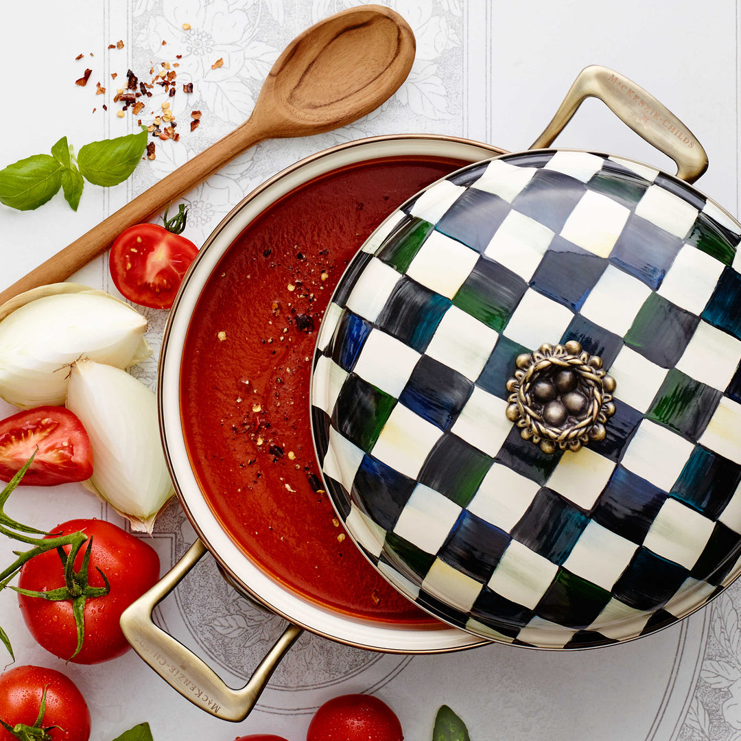 Courtly Check Enamel 3 Quart Casserole with lid, filled with tomato soup and fresh ingredients.