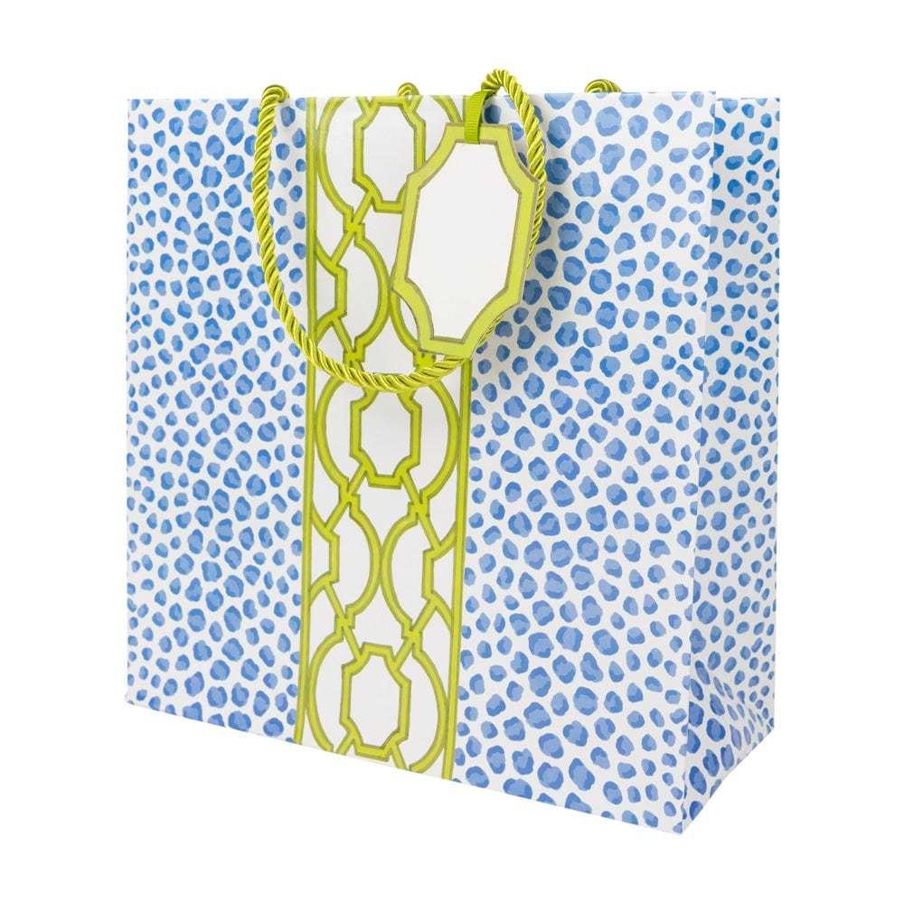 Medium square gift bag in blue and green with a spotted knot pattern on durable paper.