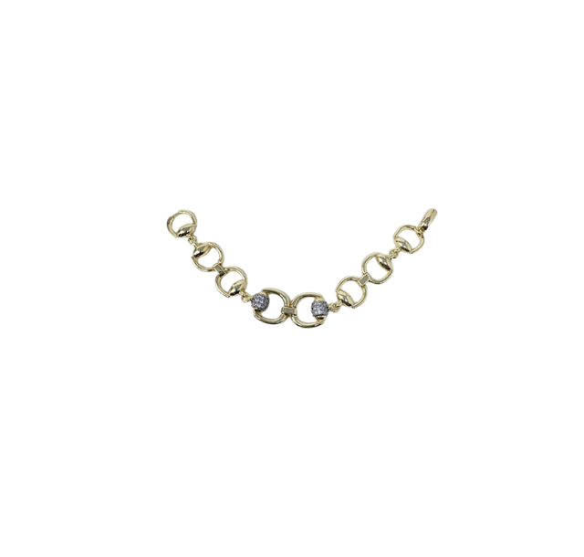 Gold horsebit link bracelet featuring two pave diamond-encrusted circular accents.
