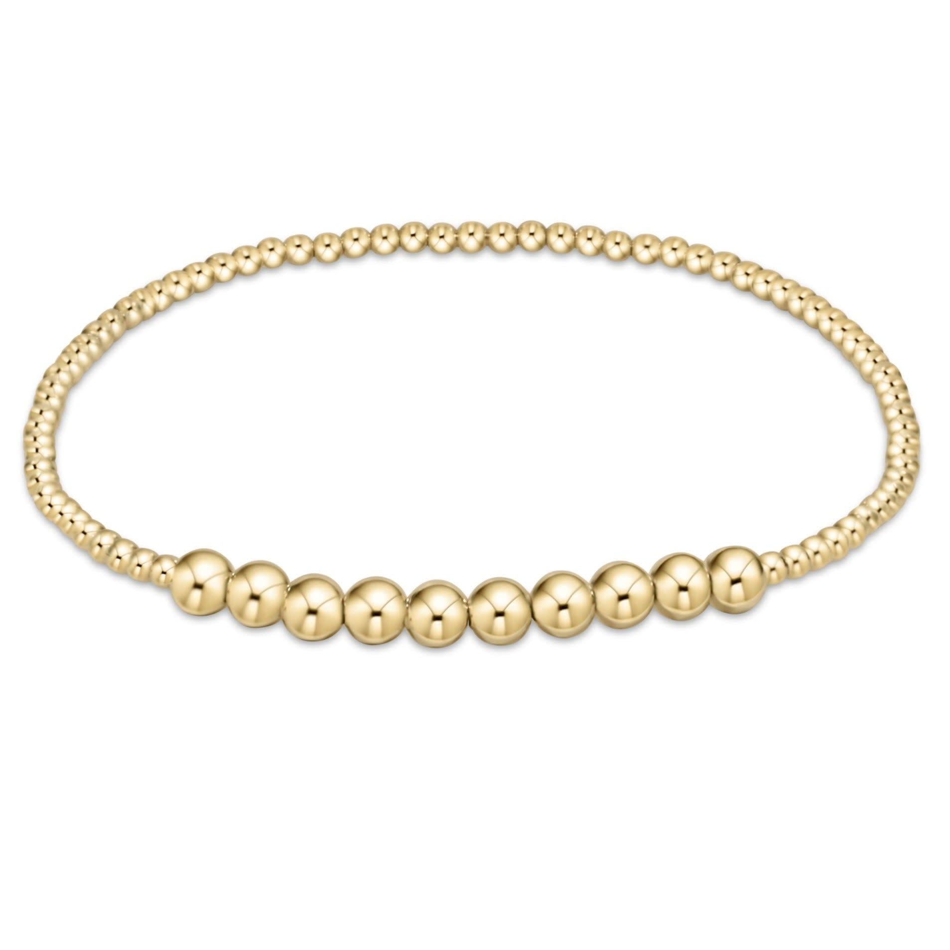 Gold beaded bracelet featuring 2mm beads with a center row of ten 4mm gold-filled beads.