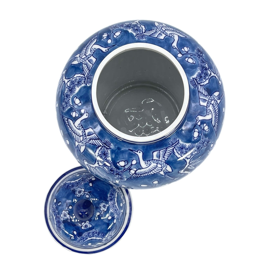 Blue and white ceramic ginger jar with floral crane chinoiserie pattern
