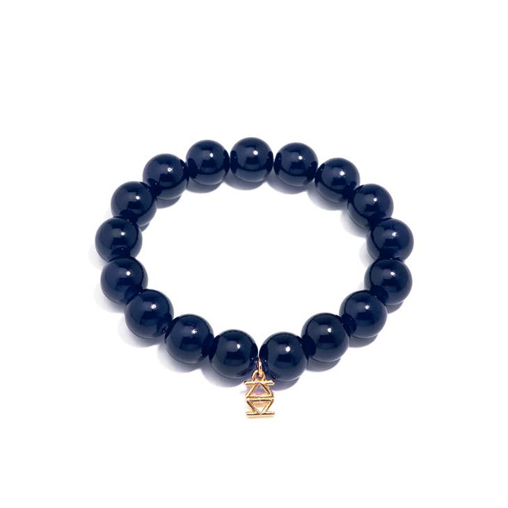 Stretch bracelet with glossy lucite glass beads in a neutral tone.