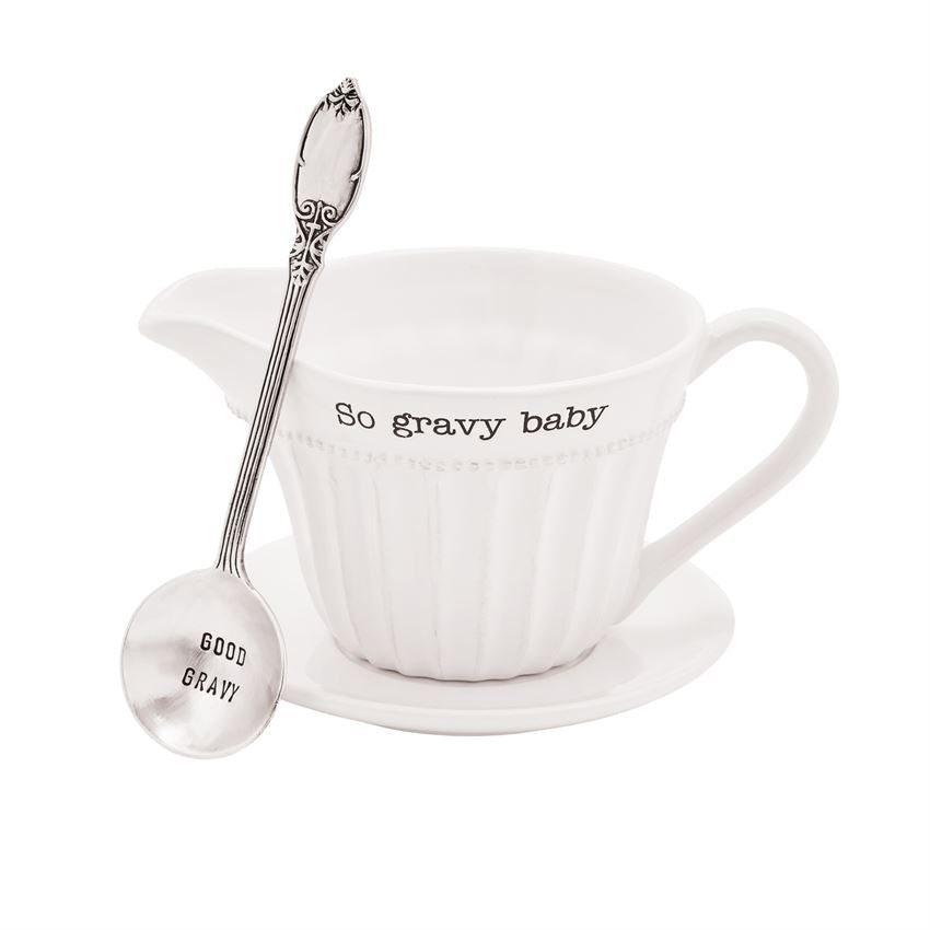 Fluted ceramic gravy boat in dolomite with debossed sentiment, matching saucer and silverplate ladle.