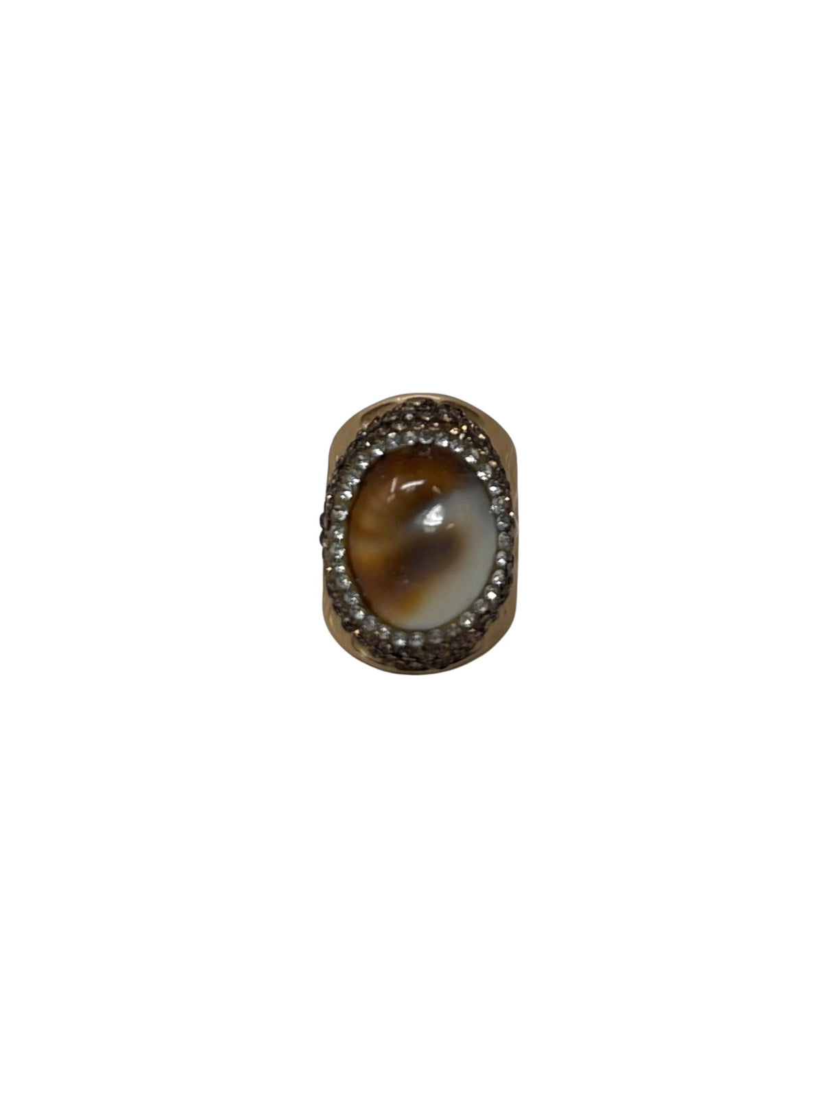 Queen of Sheba fashion ring featuring an oval brown and white stone surrounded by small crystals.