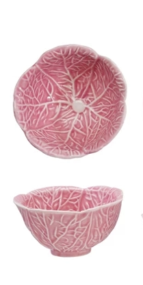 Pink stoneware prep bowl shaped like a cabbage with leafy rim detail.