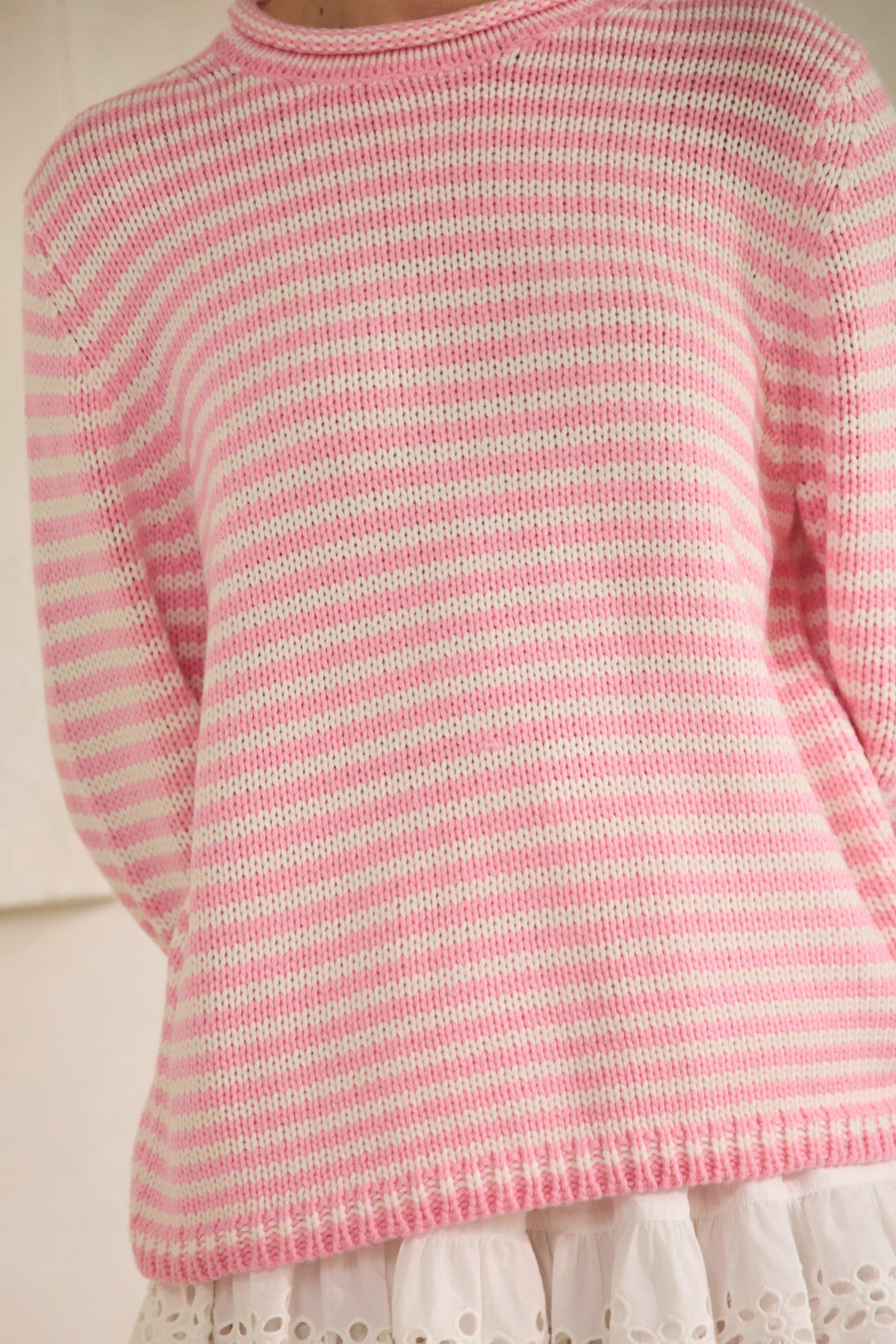 Oversized Selene striped knit sweater in soft gray with dropped shoulders, ribbed cuffs, and a side slit detail.