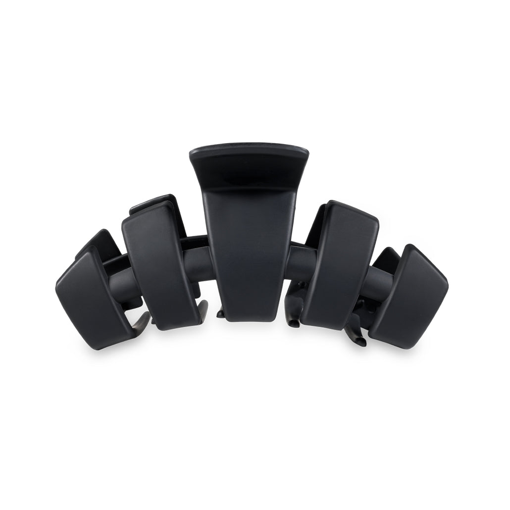 Medium-sized classic hair clip in a neutral tone with a smooth rectangular shape.