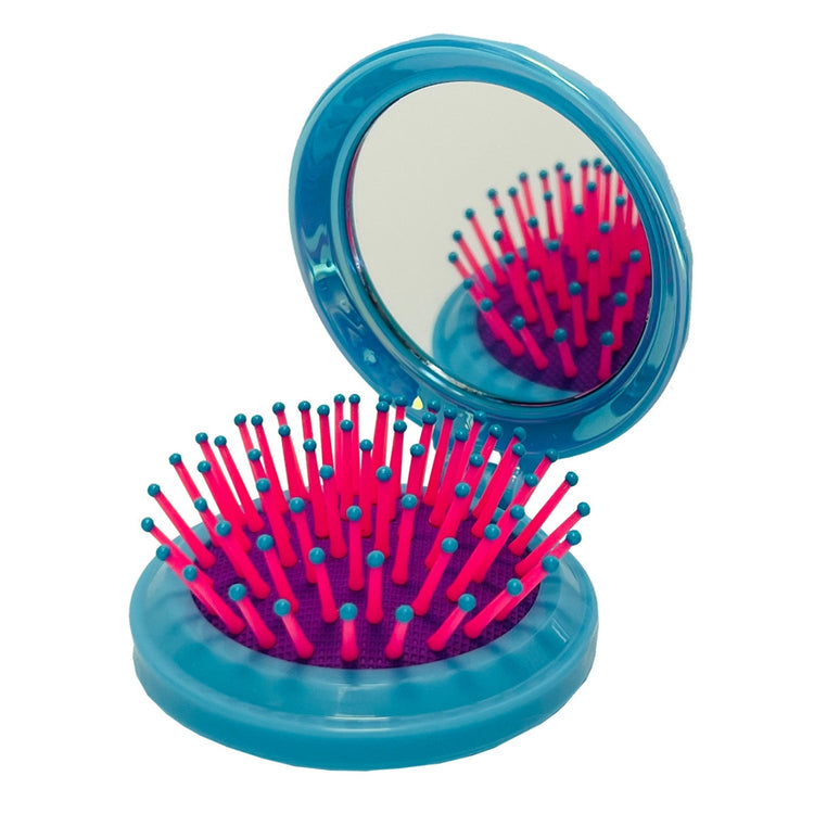 Foldable ABS hairbrush with a circular jeweled mirror top.