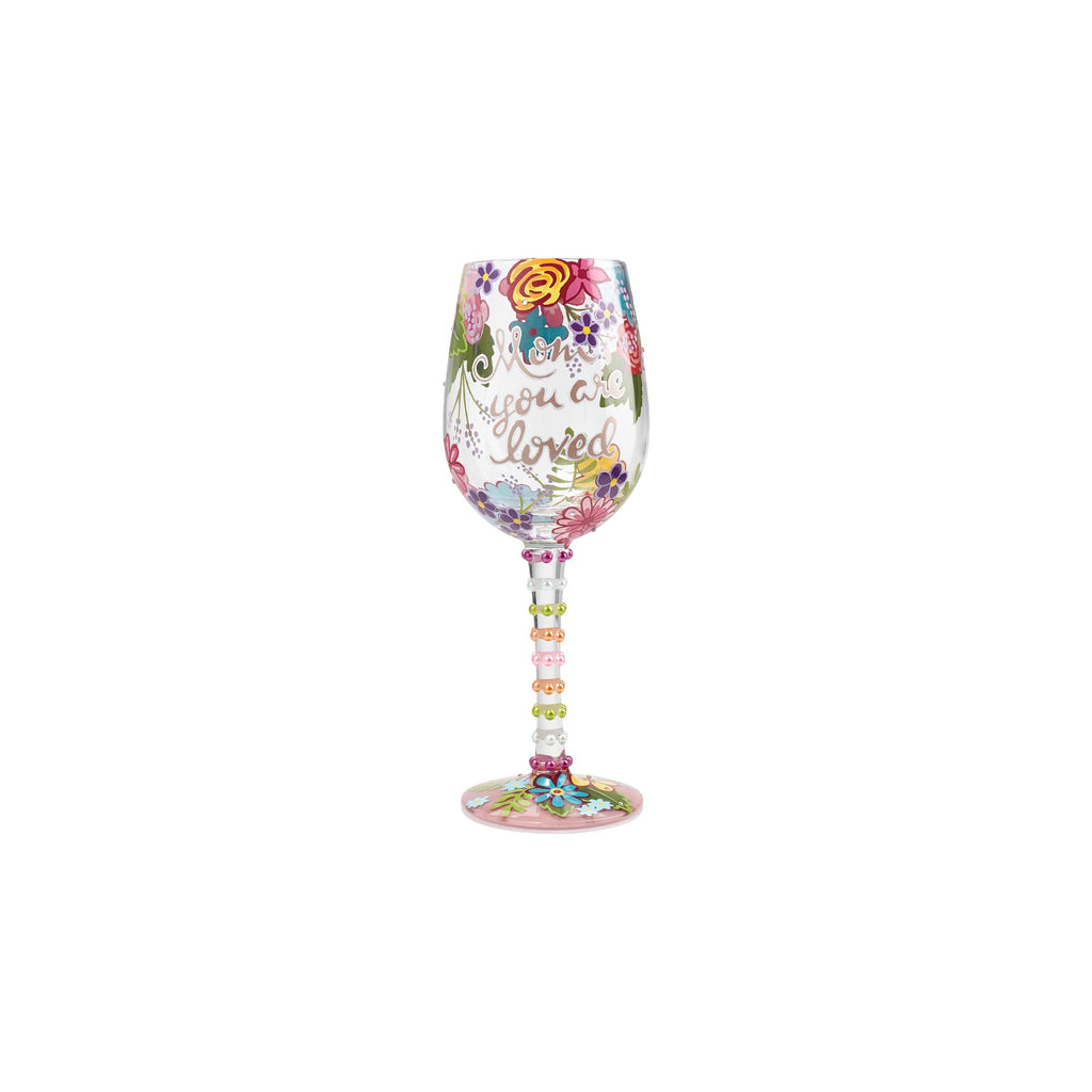 Blown glass wine glass with hand-painted colorful cocktail recipe base and glitter accents.